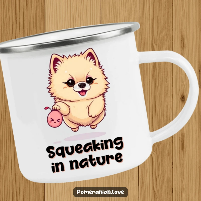 Funny camping mug with a determined Pomeranian leaping for a tiny squeaky toy, perfect for adventurous outings.