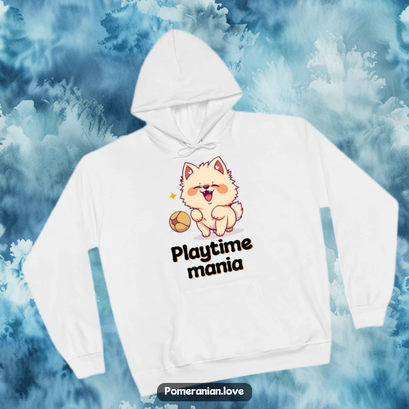 Funny Pomeranian dog character barking with pure excitement at a bouncing ball, captured in a cozy design on this hoodie.