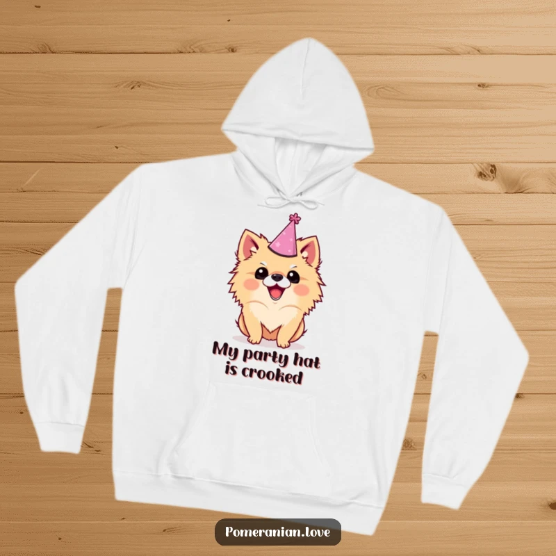 Funny Pomeranian hoodie featuring an excited dog wearing a crooked party hat, looking ready for fun, a perfect cozy gift.