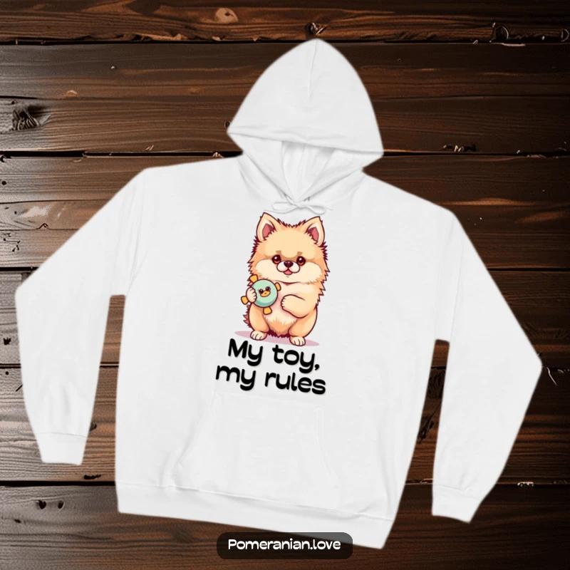 Funny Pomeranian hoodie featuring a proud dog with a squeaky toy, offering comfort and a touch of playful humor.