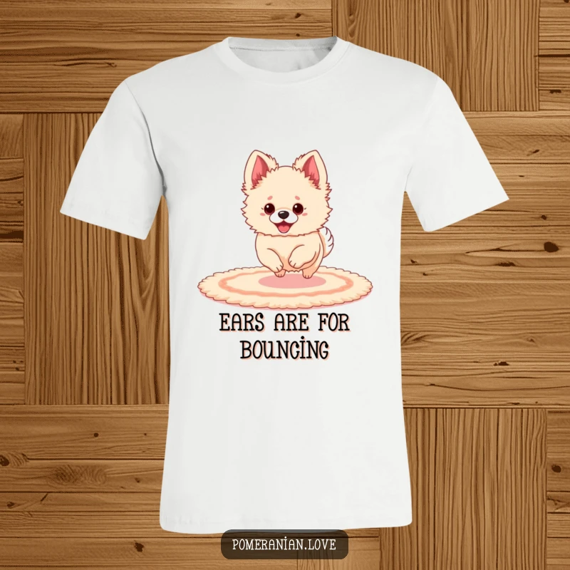 Funny Pomeranian with oversized ears playfully bouncing on a rug, printed on a soft t-shirt.