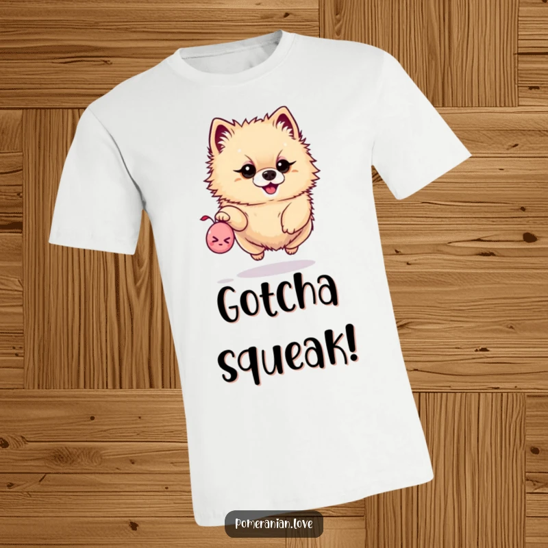 Funny t-shirt showing a determined Pomeranian soaring through the air, about to catch a tiny squeaky toy.