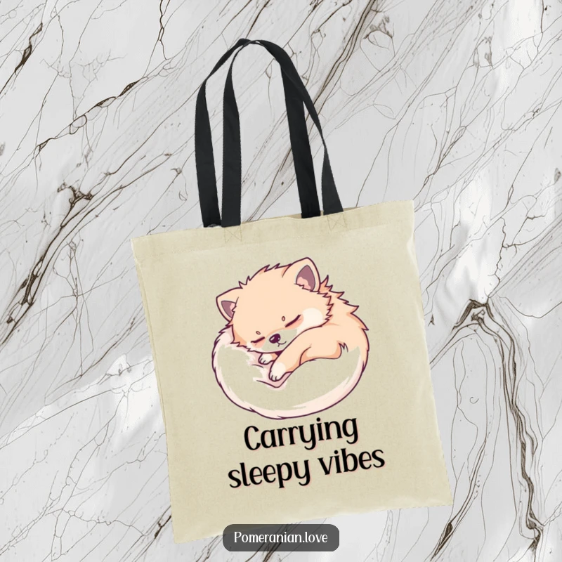 Funny Pomeranian tote bag featuring a dog peacefully sleeping, curled up in a cozy ball. Perfect for carrying essentials.
